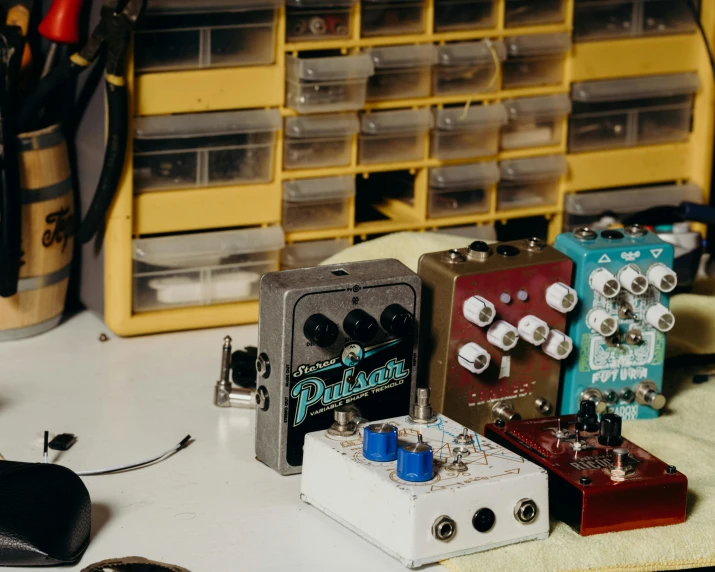 a table topped with lots of different types of pedals, trending on pexels, assemblage, with sparking circuits, high quality product image”, mid shot portrait, thumbnail