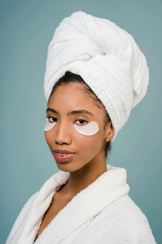 a woman with a towel wrapped around her head, trending on pexels, renaissance, eye patch over left eye, medium skin tone, aida muluneh, commercial photo