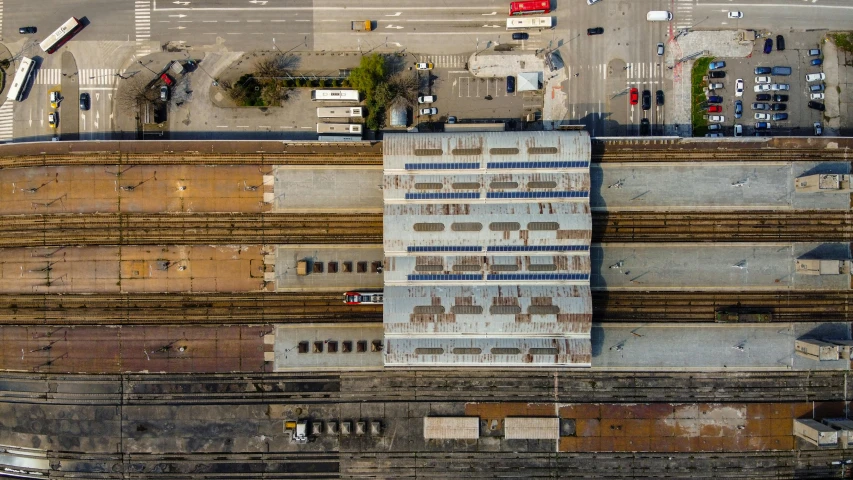 an aerial view of a train station in a city, pexels contest winner, boxcar on the railroad, panels, maintenance photo, ignant