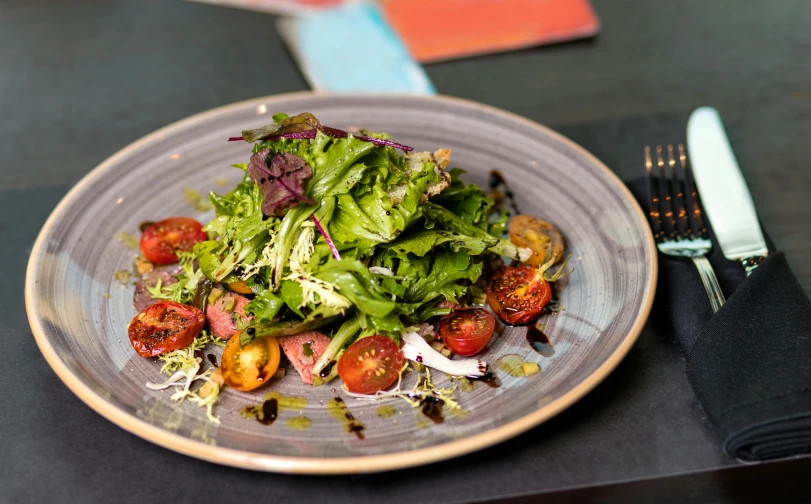 a close up of a plate of food on a table, salad, offering a plate of food, daily specials, “ iron bark