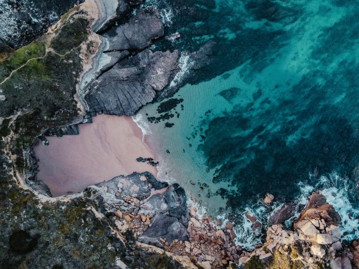 an aerial po looking down on a beach