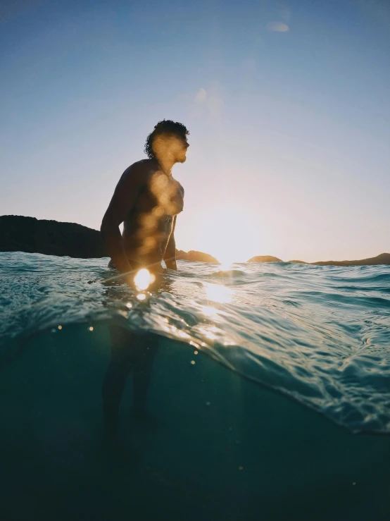 a man riding a wave on top of a surfboard, pexels contest winner, looking off into the sunset, under water swimming, profile image, slightly tanned