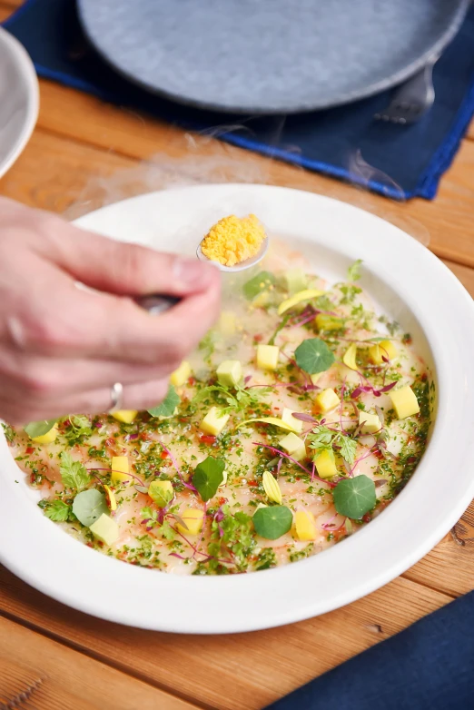 a white bowl filled with soup and other food