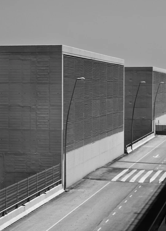 a black and white photo of a highway, a black and white photo, inspired by Andreas Gursky, postminimalism, 3 heads, metal cladding wall, industrial colours, 3 doors