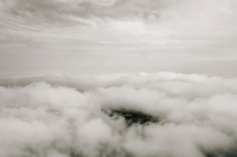 black and white po of a circle in the clouds