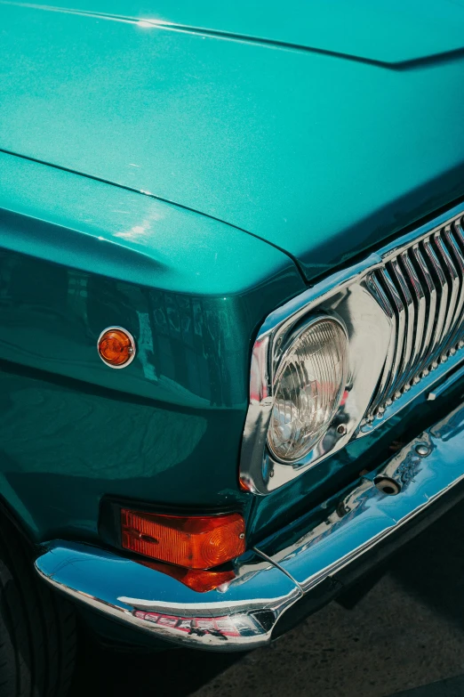 front lights on an old blue and white car