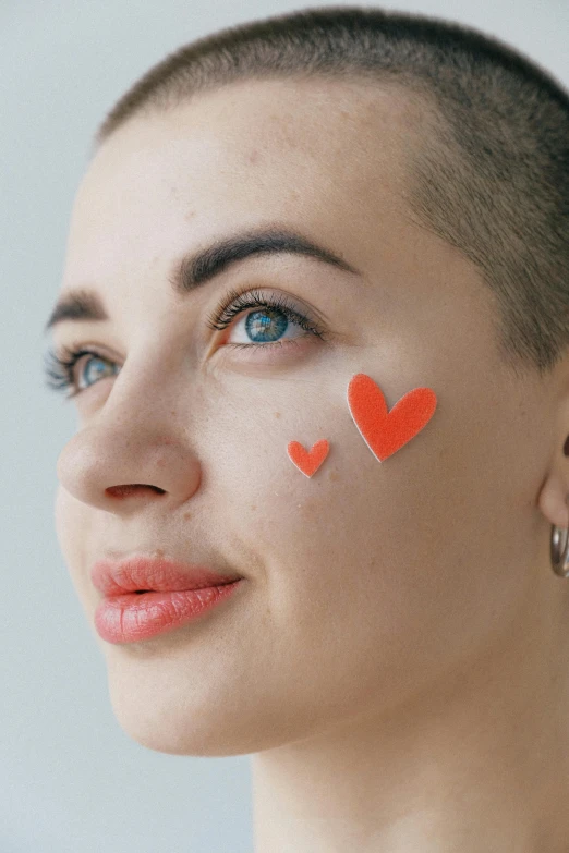 a woman with red hearts painted on her face, a tattoo, by Julia Pishtar, trending on pexels, antipodeans, shaved sides, face icon, noticeable tear on the cheek, illustration of to pout