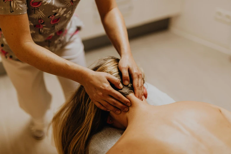 a woman getting a massage at a spa, unsplash, manly, thumbnail, hestiasula head, lachlan bailey