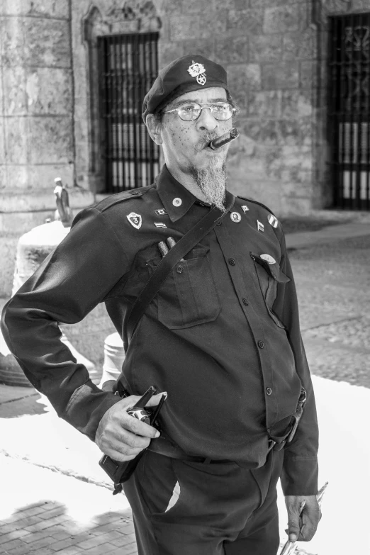 an old man in uniform smiling for a picture