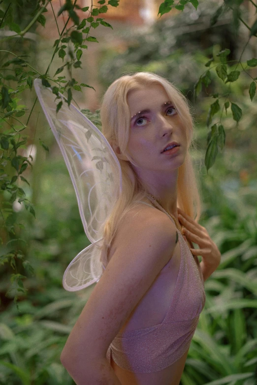a woman in a fairy costume posing for a picture, inspired by David LaChapelle, reddit, magic realism, ava max, ethereal!!! ultra realistic, film still dnd movie, medium closeup