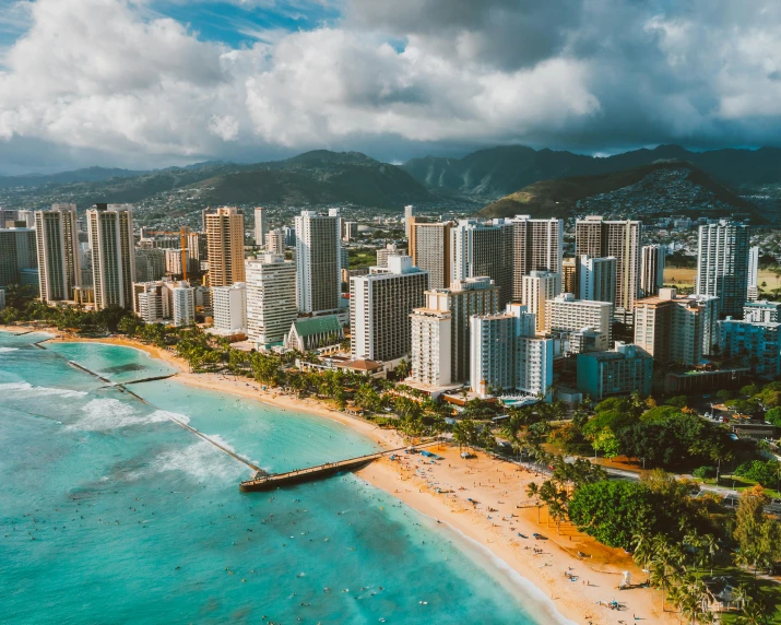 a view of some beautiful beach with buildings around it