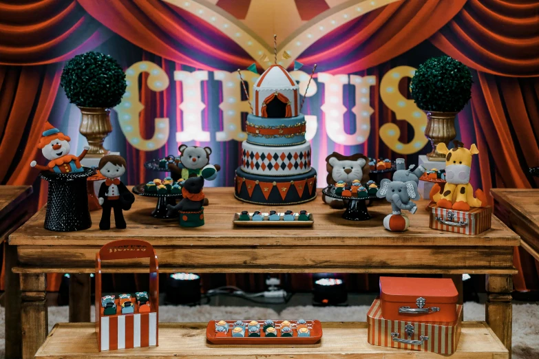 a wooden table topped with a cake covered in frosting, inspired by The Family Circus, pexels contest winner, coliseum backdrop, 🦩🪐🐞👩🏻🦳, toys, orange theme