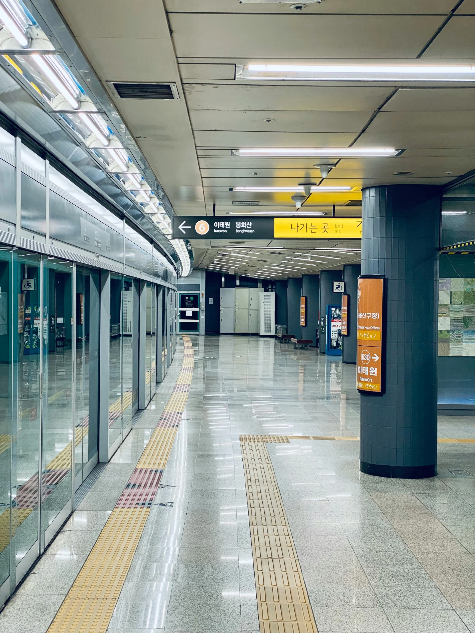 a subway train pulling into a station next to a platform, inspired by jeonseok lee, unsplash, hyperrealism, yellow carpeted, square, 2022 photograph, けもの