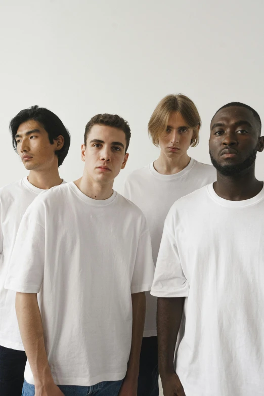 a group of young men standing next to each other, an album cover, pexels contest winner, man in white t - shirt, virgil abloh, with a white complexion, 5 0 0 px models
