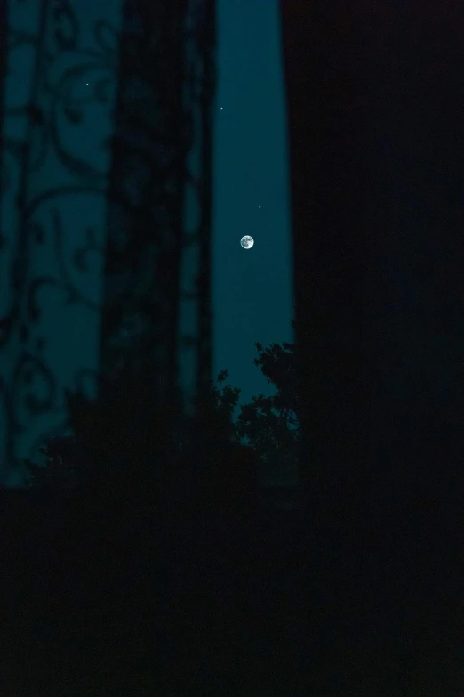 a full moon is seen through the trees, a picture, inspired by Elsa Bleda, unsplash, tonalism, mermaids in distance, 3 moons, cinestill 800t 50mm eastmancolor, crescent moon