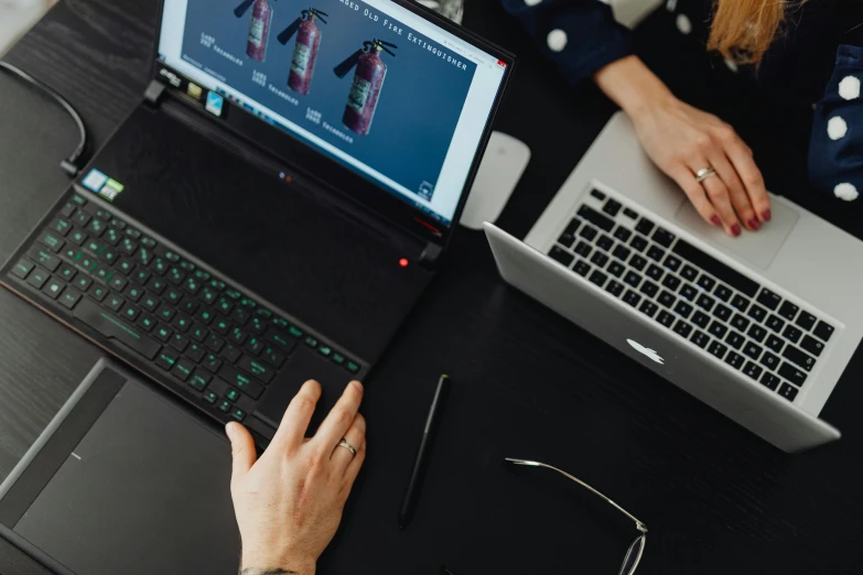 a couple of people sitting at a table with laptops, a computer rendering, trending on pexels, nvidia promotional image, close up to the screen, chemistry, 9 9 designs