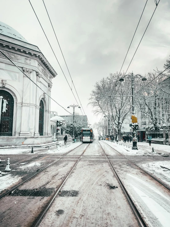 snow is covering the ground in front of a building