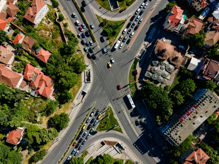 an aerial s of cars moving through a city