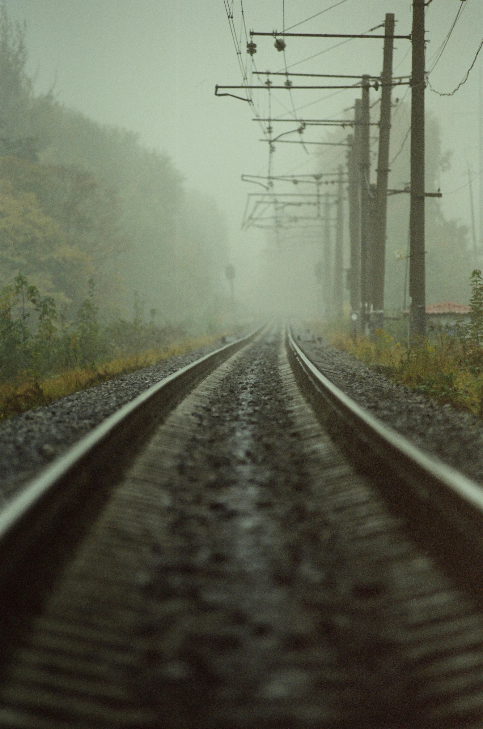 view of railroad tracks in the middle of the day