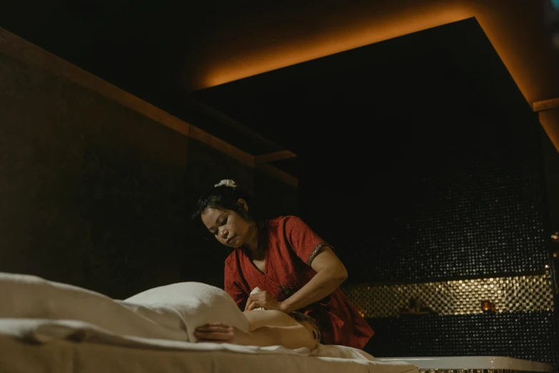 a woman that is laying down on a bed, serving body, bao pham, gurney with ambient lighting, embroidered robes