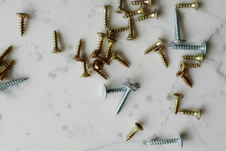 a bunch of screws sitting on top of a table, trending on pexels, renaissance, all marble, flat lay, various colors, product introduction photo