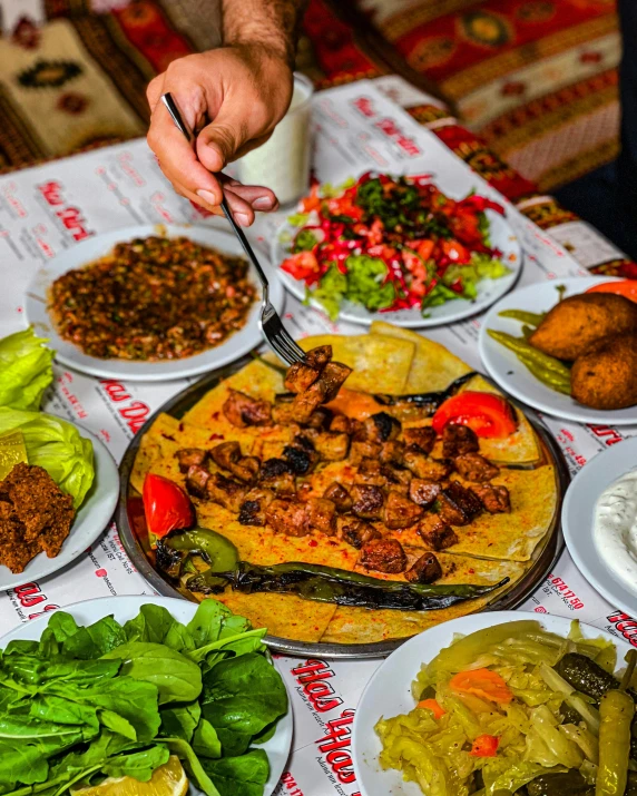a number of plates of food on a table, dau-al-set, profile image, gif, located in hajibektash complex, vibrant scene