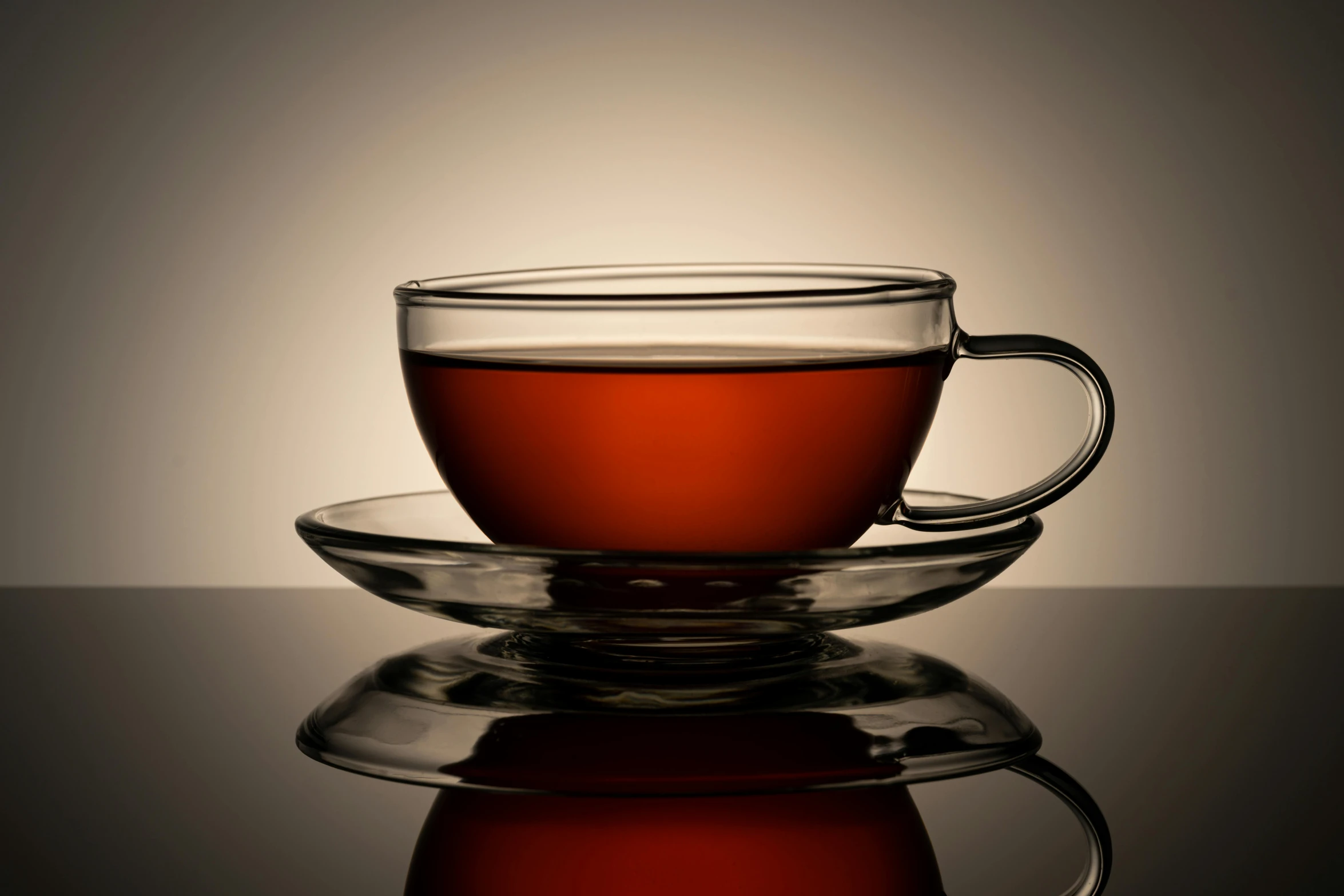 a cup of tea sitting on top of a saucer, pexels, photorealism, dark red, square, with clear glass, high resolution