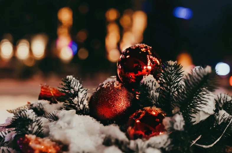 a pile of christmas decorations sitting on top of snow