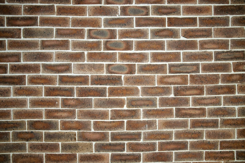 a large brick wall is shown with very little dirt