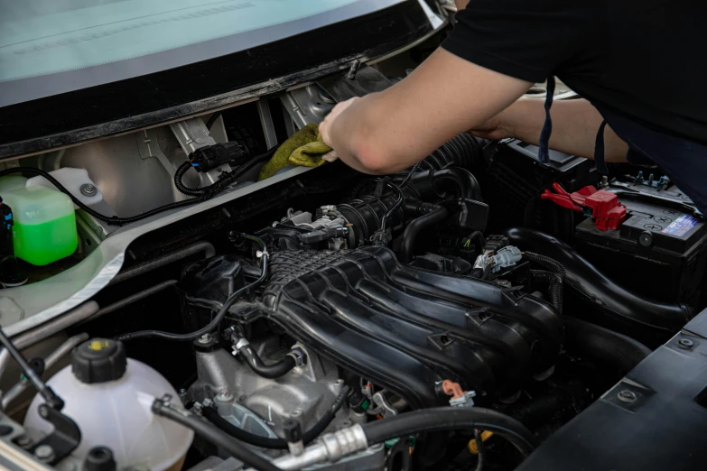 a man is working on a car engine, a picture, shutterstock, 15081959 21121991 01012000 4k, clean detail, instagram post, rectangle