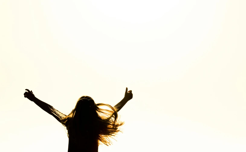 a silhouette of a woman with her arms in the air, pexels, figuration libre, brown flowing hair, highkey, happy people, rectangle
