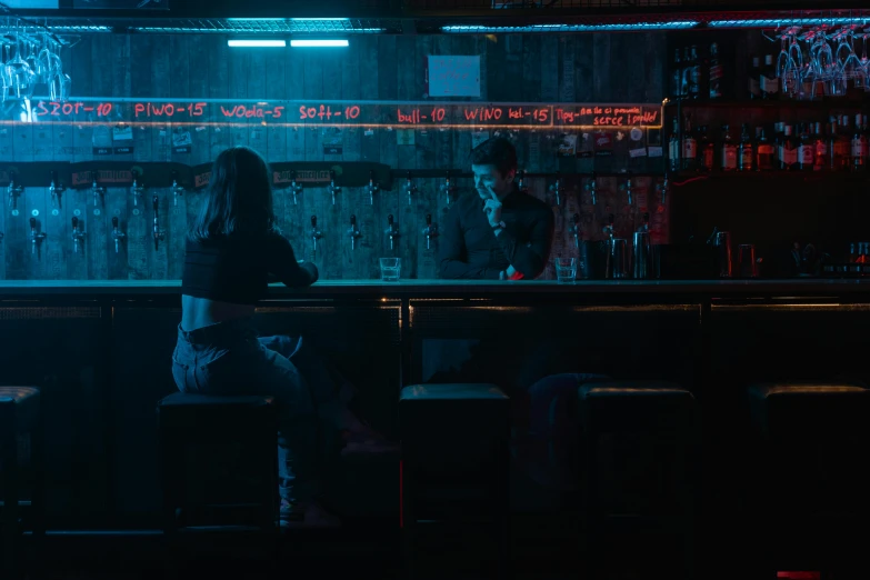 a woman sitting at a bar in the dark, inspired by Elsa Bleda, unsplash contest winner, serial art, medium shot of two characters, red and blue neon, lee madgwick & liam wong, grindhouse