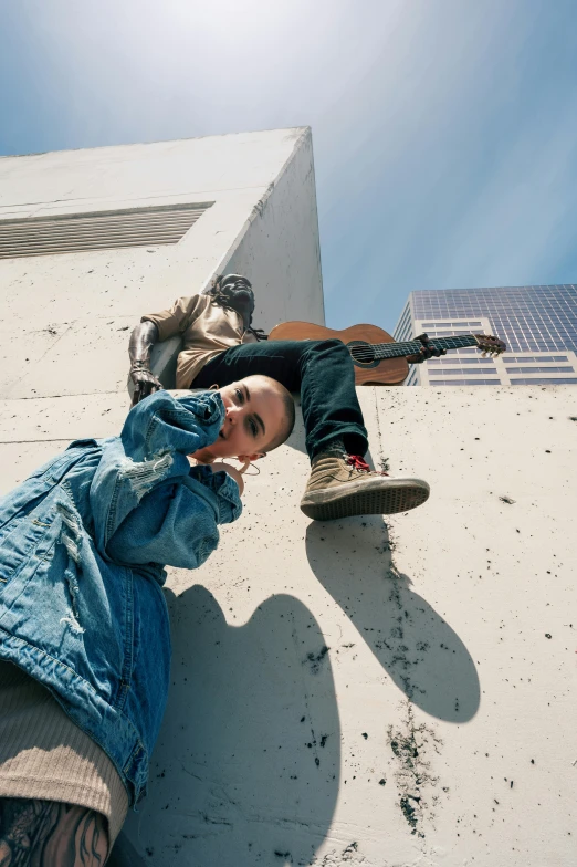 a man riding a skateboard up the side of a building, an album cover, by Winona Nelson, unsplash, wearing blue jean overalls, sittin, joey king, overhead sun