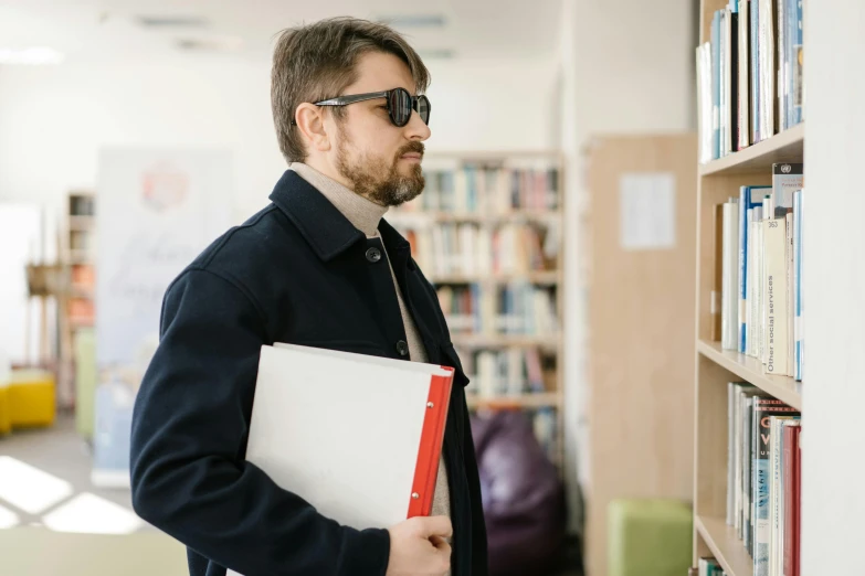 a man standing in a library holding a folder, trending on reddit, implanted sunglasses, in australia, teacher, bank robbery movies
