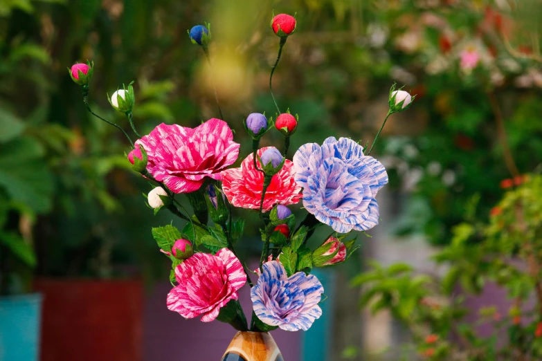 a floral arrangement in a vase, with small flowers