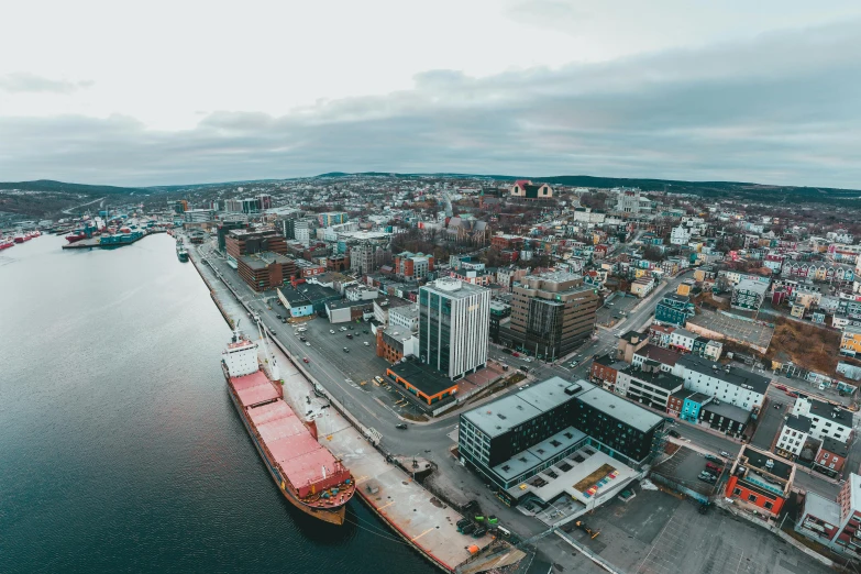 a large body of water next to a city, by Brian Snøddy, pexels contest winner, happening, port, drone footage, 4k panoramic, profile picture 1024px