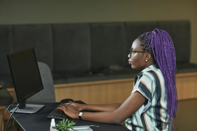 a woman sitting at a desk using a computer, trending on pexels, aida muluneh, 15081959 21121991 01012000 4k, thumbnail, profile image