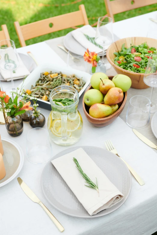 a table set with dishes and plates with place settings