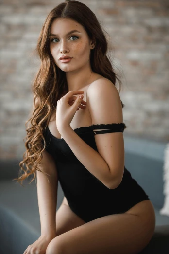a woman in a black bodysuit sitting on a couch, trending on pexels, wavy lingeries, beautiful young asian woman, over the shoulder, anna nikonova aka newmilky