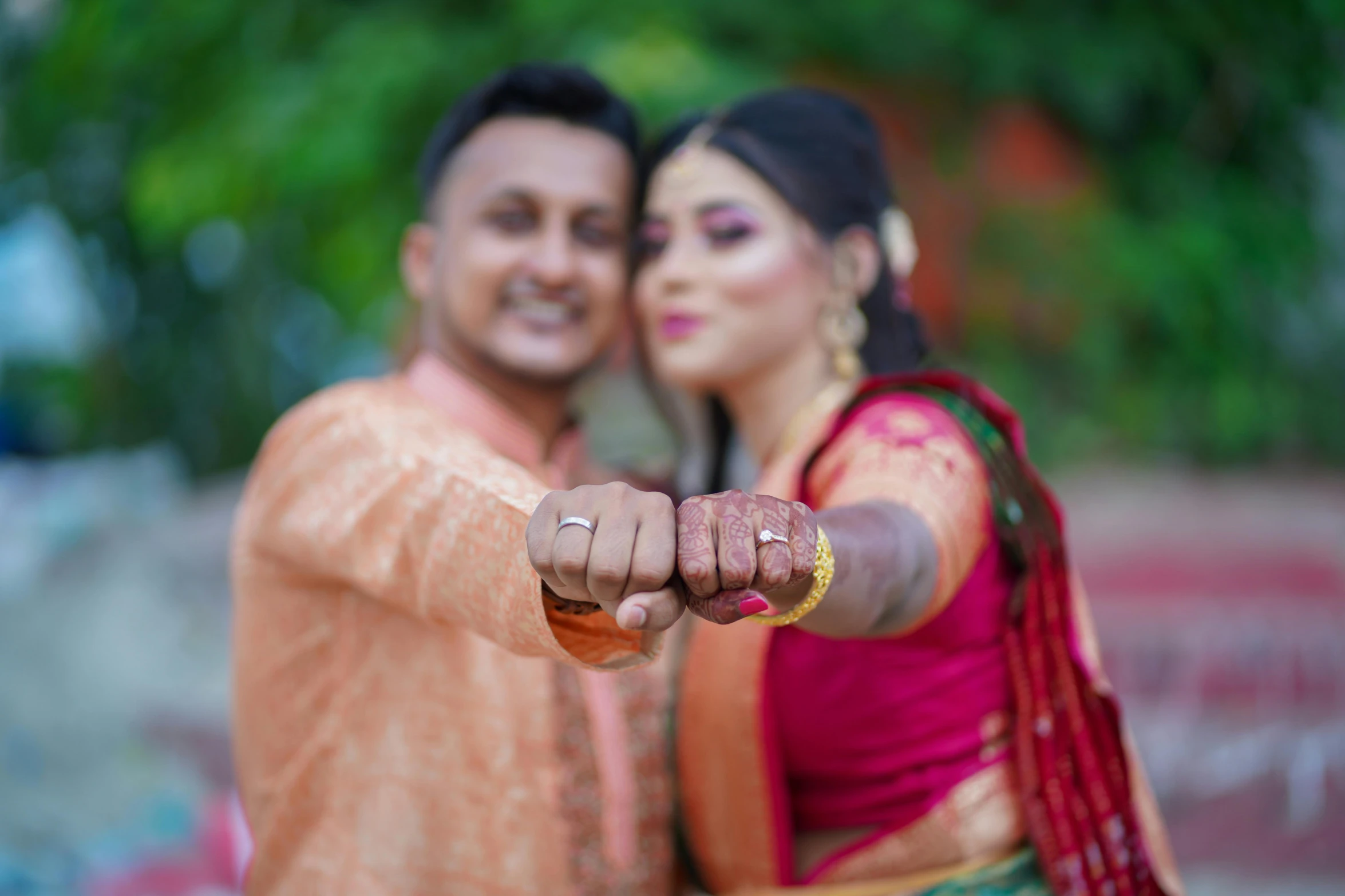 a man and a woman posing for a picture, by Daryush Shokof, pexels, hurufiyya, hands, assamese, 15081959 21121991 01012000 4k, celebrating