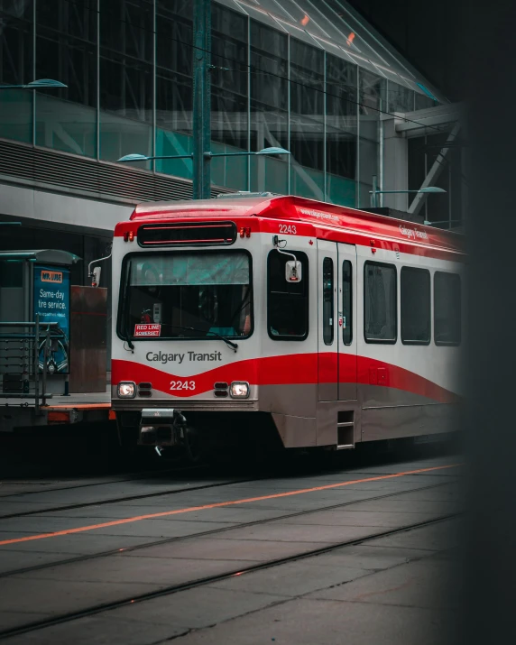 a train traveling down the tracks near a train station