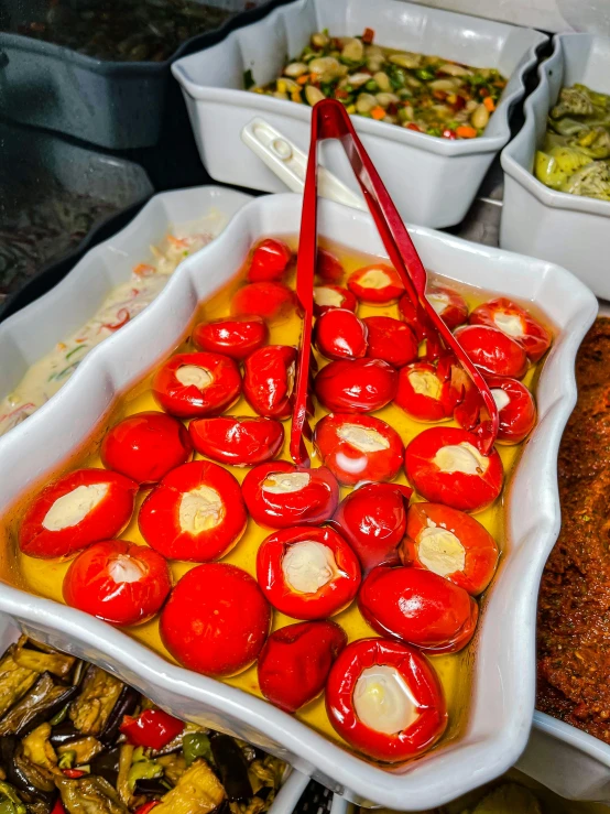 a table topped with lots of different types of food, in a red dish, thumbnail, red hoods, maintenance photo