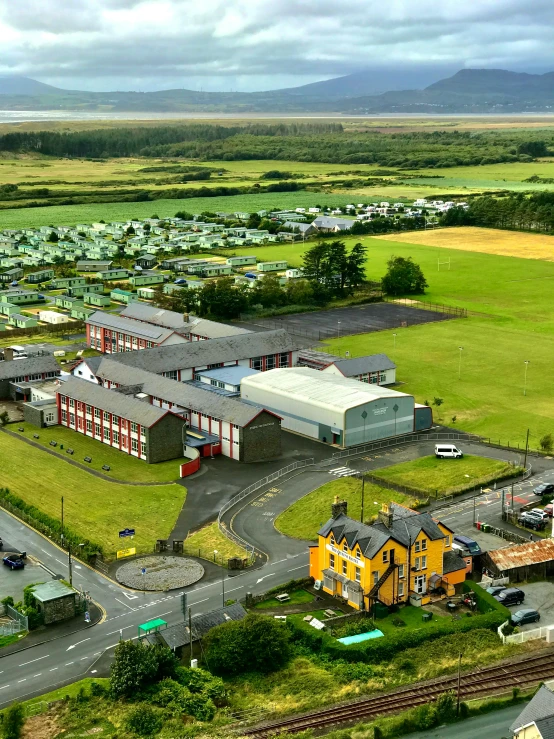 a bird's eye view of a small town, by Bedwyr Williams, pexels contest winner, northwest school, military buildings, panoramic shot, whealan, thumbnail