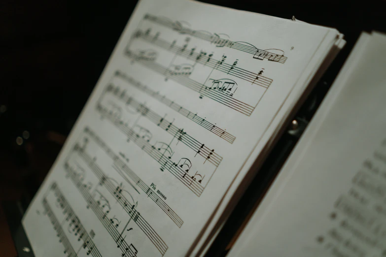 an open music book with musical notes in it