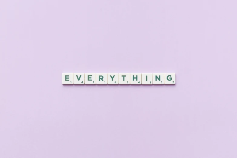 the word everything spelled with scrabbles on a purple background, a picture, by Carey Morris, trending on pexels, aestheticism, on a pale background, clean minimalist design, the universe and everything, knolling