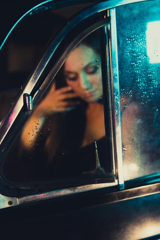 a woman holding a cell phone to her face