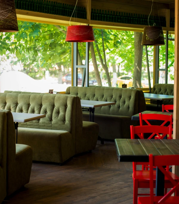 a restaurant filled with lots of tables and chairs, pexels, green bright red, demur, a wooden, romanian