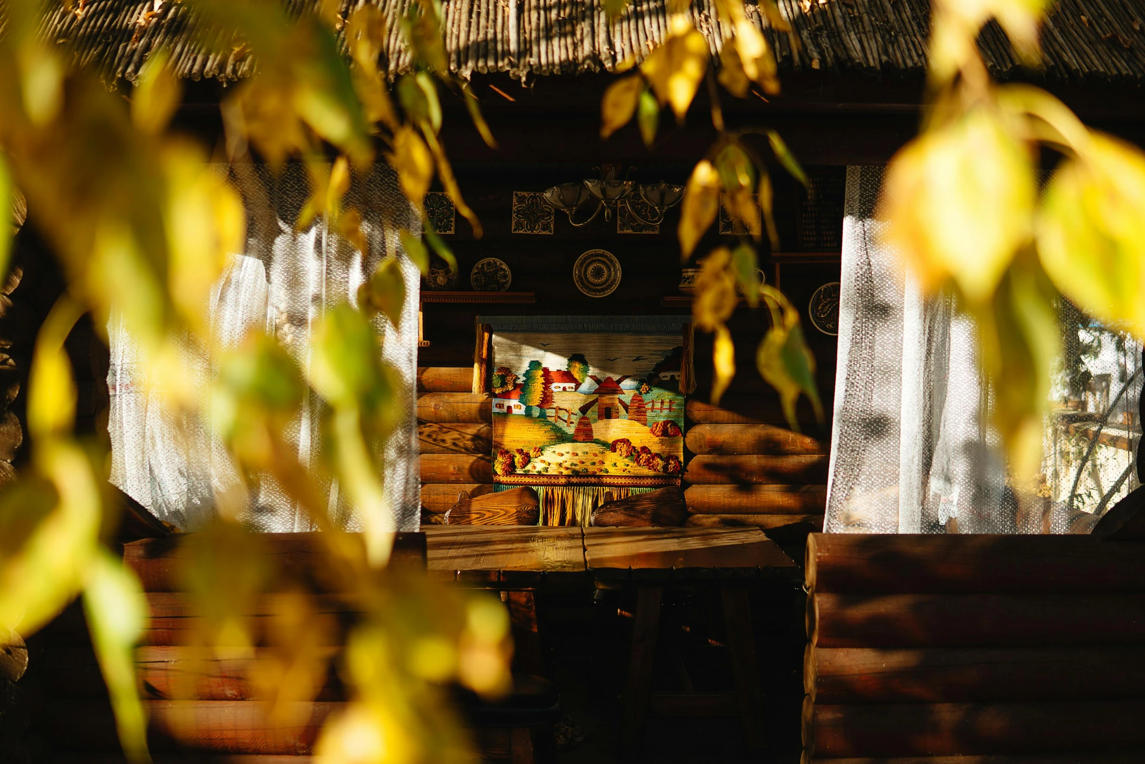 a table that has some food on it, a portrait, pexels contest winner, hurufiyya, thatched roof, golden colors, in a tree house, thumbnail