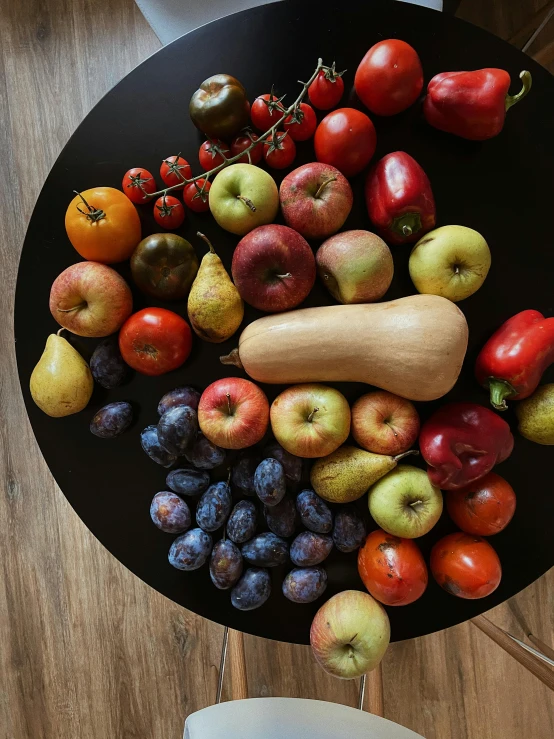 a black plate topped with assorted fruits and vegetables, 5k, pears, highresolution, taken with sony alpha 9
