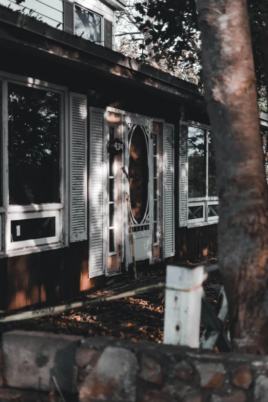 a black and white photo of a house, a colorized photo, inspired by Elsa Bleda, unsplash contest winner, cottage close up, ✨🕌🌙, brown and white color scheme, forest outside